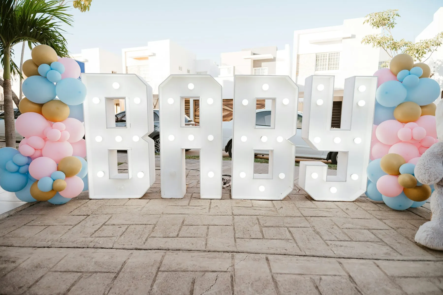 Illuminated BABY letters with balloons