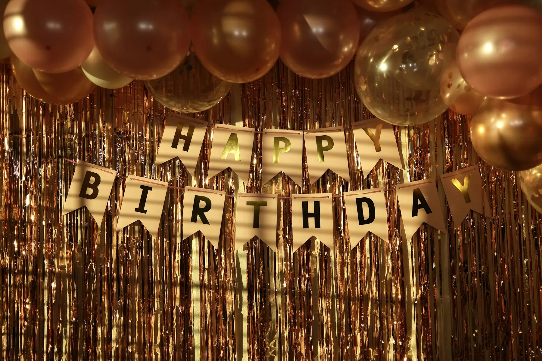 Happy Birthday banner with balloons and streamers