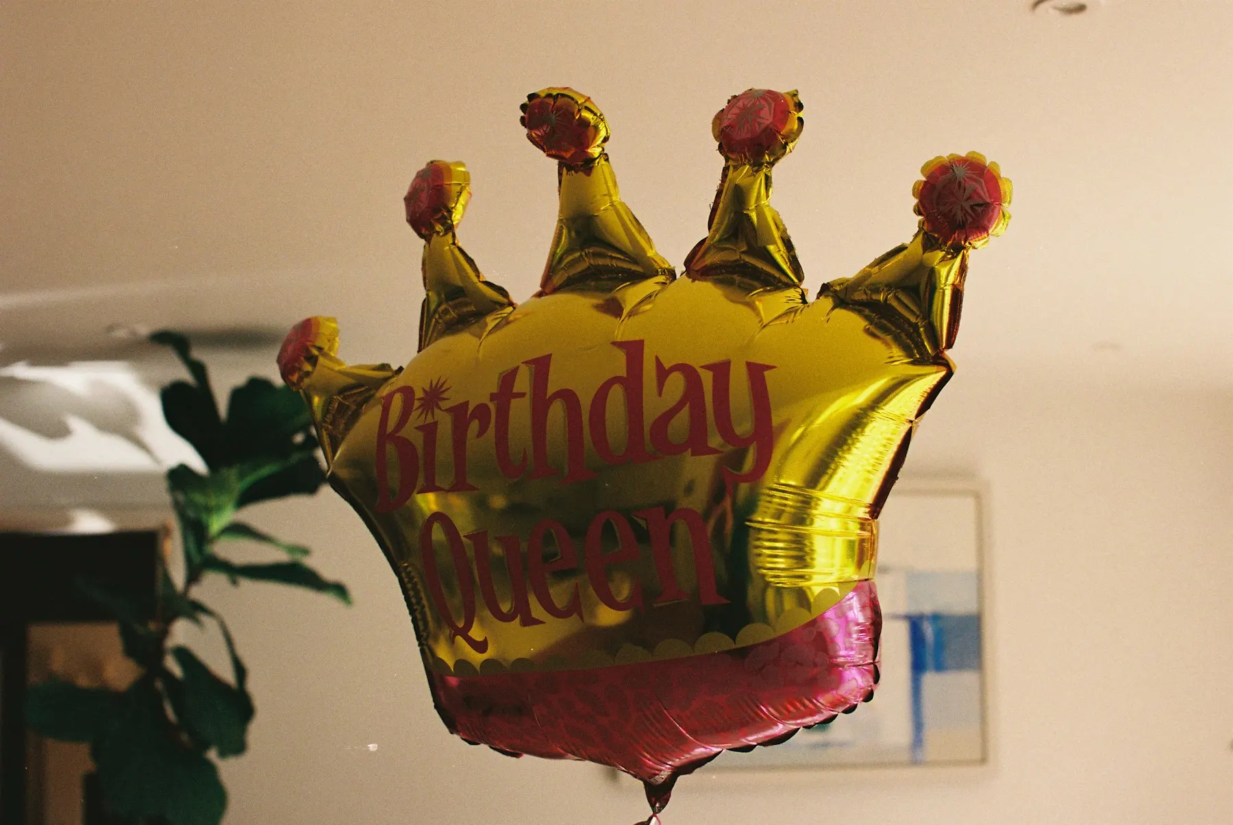 Gold crown foil balloon for a birthday