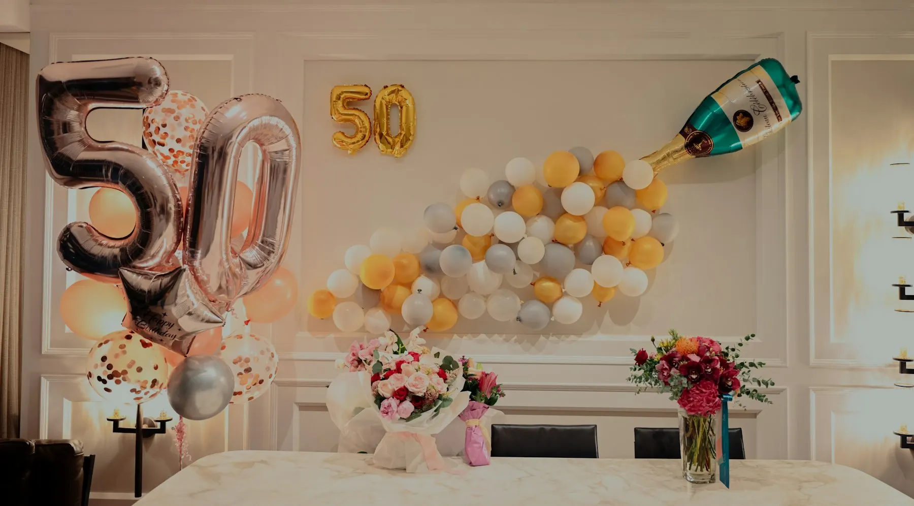 Yellow and white balloons on a party table