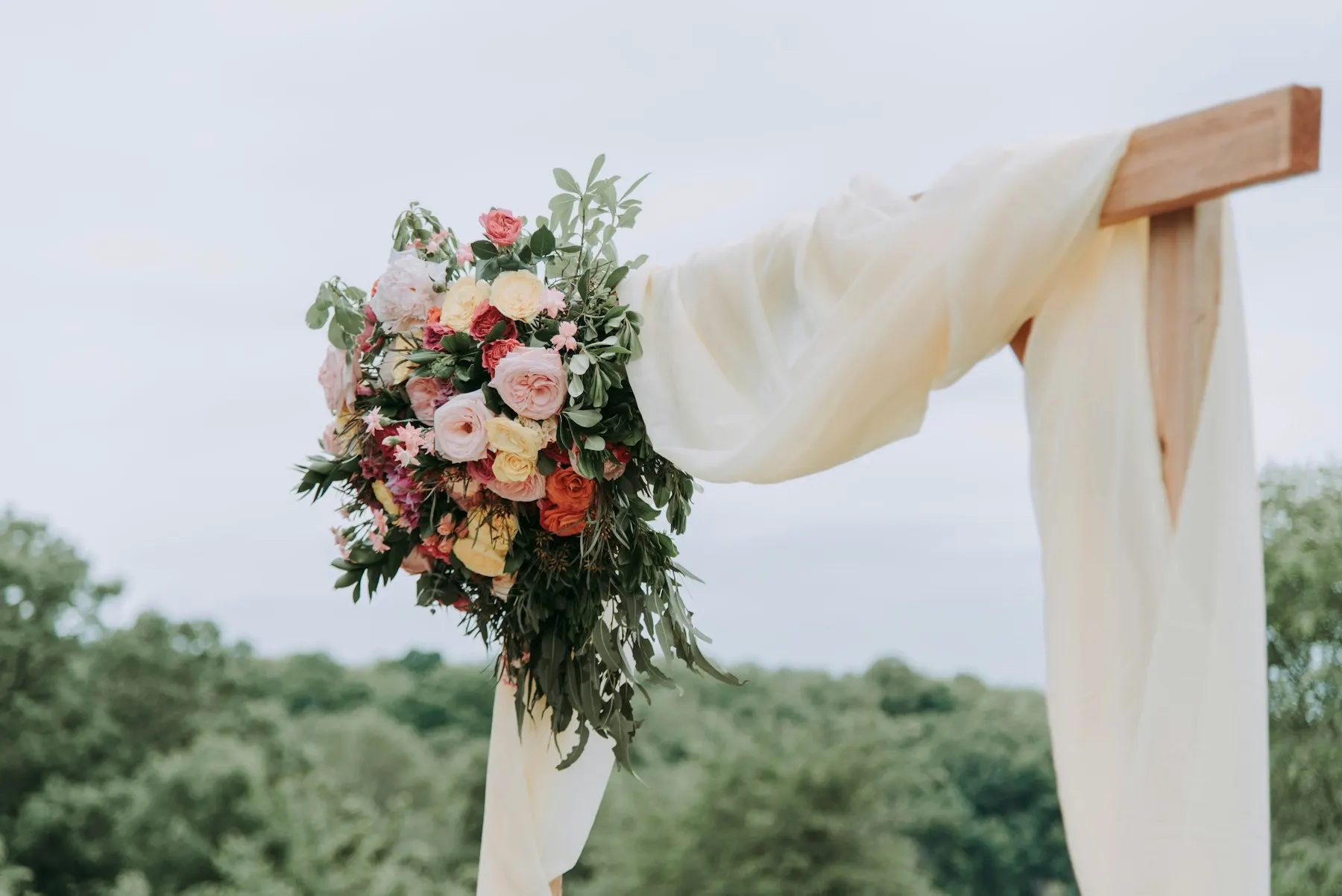 Floral backdrop with white drapes